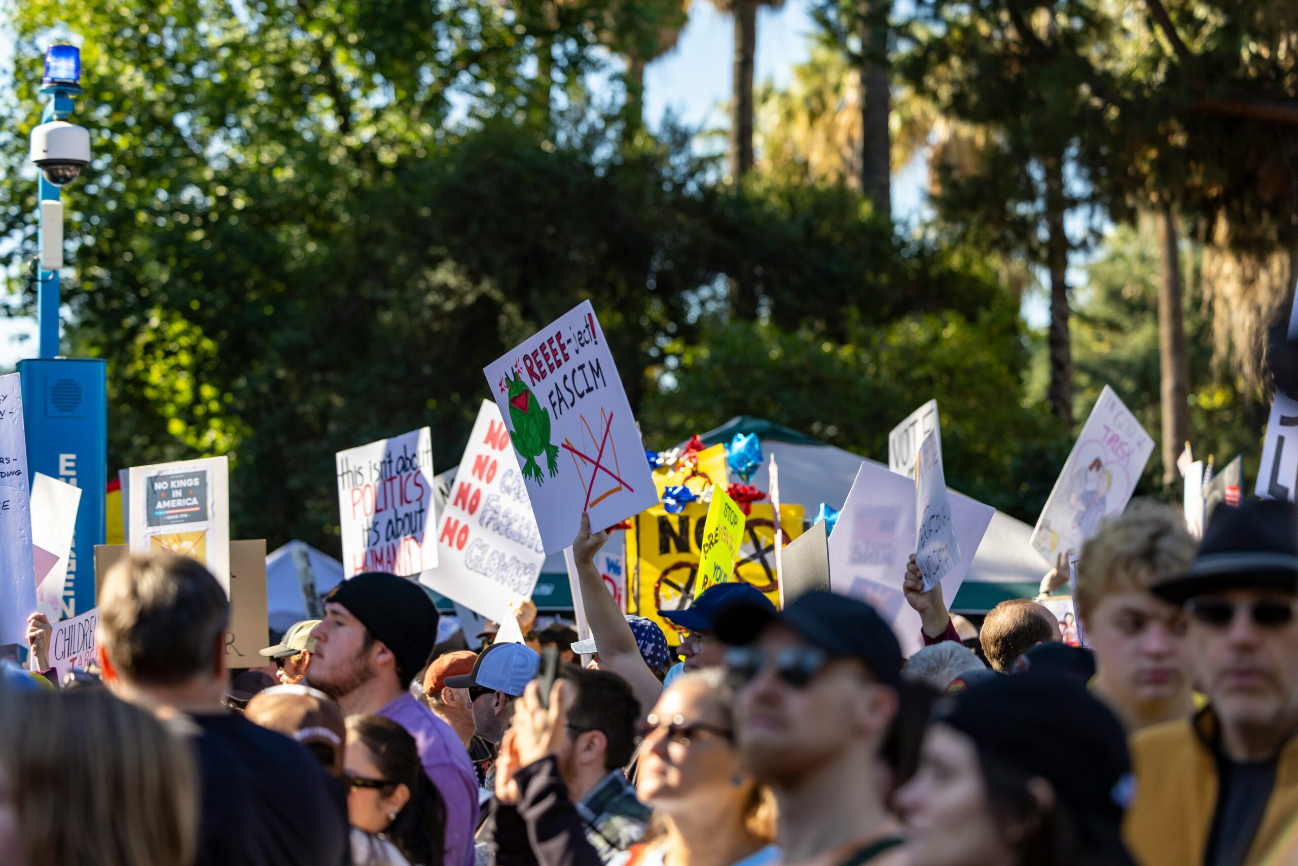 Protesters holding signs.